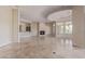 Open living room with tile floors and a cozy fireplace at 22318 N 36Th St, Phoenix, AZ 85050