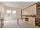 Home office with built-in shelving and a large desk at 22318 N 36Th St, Phoenix, AZ 85050