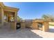 Outdoor kitchen features grill, oven, and refrigerator at 22318 N 36Th St, Phoenix, AZ 85050