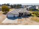 Aerial view of house with a three-car garage and large yard at 22610 S 174Th St, Gilbert, AZ 85298