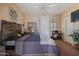 Bedroom with a large bed, ceiling fan and plenty of natural light at 2367 W Jake Hvn, Phoenix, AZ 85085