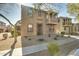 Two-story house with tan stucco exterior, balcony, and landscaped front yard at 2367 W Jake Hvn, Phoenix, AZ 85085