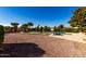 Large backyard with pebble landscaping and refreshing pool at 2714 N 63Rd St, Mesa, AZ 85215