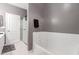 Bathroom featuring a bathtub, shower and a large mirror at 2714 N 63Rd St, Mesa, AZ 85215