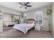 Bedroom with mirrored closet doors and a queen-sized bed at 2714 N 63Rd St, Mesa, AZ 85215