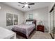 Bright bedroom with a double bed, window coverings and ceiling fan at 2714 N 63Rd St, Mesa, AZ 85215