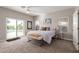 Spacious bedroom with sliding doors leading to a pool view at 2714 N 63Rd St, Mesa, AZ 85215