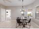 Charming breakfast nook with a table and four chairs, adjacent to the kitchen at 2714 N 63Rd St, Mesa, AZ 85215