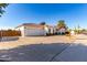 Single-story home with a two-car garage and a gated entrance at 2714 N 63Rd St, Mesa, AZ 85215