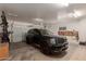 Garage with car, storage, and bicycle rack at 2714 N 63Rd St, Mesa, AZ 85215