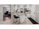 Kitchen boasts granite countertops and white cabinets at 2714 N 63Rd St, Mesa, AZ 85215
