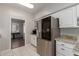 Eat-in kitchen with stainless steel appliances and granite counters at 2714 N 63Rd St, Mesa, AZ 85215