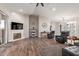 Open living area with hardwood floors and a cozy fireplace at 2714 N 63Rd St, Mesa, AZ 85215