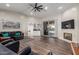 Spacious living room featuring a fireplace, hardwood floors, and ample natural light at 2714 N 63Rd St, Mesa, AZ 85215