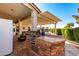 Built-in outdoor kitchen with grill and ample counter space at 2714 N 63Rd St, Mesa, AZ 85215