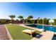 Relaxing poolside area with games and plenty of space for entertaining at 2714 N 63Rd St, Mesa, AZ 85215