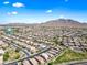 Elevated aerial picture offering a view of homes, streets, and natural surroundings in a planned community at 2776 E Mews Rd, Gilbert, AZ 85298