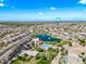High angle shot captures the expansive community, golf course, and neighborhood amenities like a pool and park at 2776 E Mews Rd, Gilbert, AZ 85298