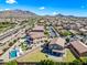 Scenic aerial view of a neighborhood, showing homes with pools and well-manicured yards at 2776 E Mews Rd, Gilbert, AZ 85298