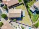 Birds eye view of a well-maintained backyard and neighborhood with lush greenery and pools at 2776 E Mews Rd, Gilbert, AZ 85298
