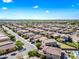 Birds eye view of a residential area with single-Gathering homes featuring tile roofs, neat landscaping, and neighborhood streets at 2776 E Mews Rd, Gilbert, AZ 85298