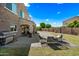 Spacious backyard featuring a well-maintained lawn, patio area, and privacy fence at 2776 E Mews Rd, Gilbert, AZ 85298