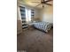 Cozy bedroom featuring a comfortable bed, window and a neutral color scheme at 2776 E Mews Rd, Gilbert, AZ 85298