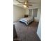 Inviting bedroom showcasing a well-lit area, ceiling fan, and a comfy bed at 2776 E Mews Rd, Gilbert, AZ 85298