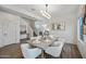 Formal dining area with modern lighting, a gray dining table, and seating for six at 2776 E Mews Rd, Gilbert, AZ 85298
