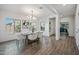 Well-lit dining room featuring a modern chandelier, tile floors, and large windows offering lots of natural light at 2776 E Mews Rd, Gilbert, AZ 85298