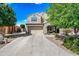 Charming two-story home with a well-manicured front yard and attached two-car garage at 2776 E Mews Rd, Gilbert, AZ 85298