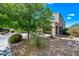 Charming two-story home with desert landscaping, mature shade tree and covered entryway enhances curb appeal at 2776 E Mews Rd, Gilbert, AZ 85298