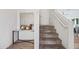 Entryway with stairway to second floor and decorative console table with mirror decor at 2776 E Mews Rd, Gilbert, AZ 85298