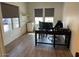 Spacious home office with large windows and built-in shelving at 2776 E Mews Rd, Gilbert, AZ 85298