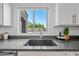 Kitchen sink and countertop area with a window view to the backyard at 2776 E Mews Rd, Gilbert, AZ 85298