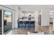 Well-lit kitchen featuring a breakfast bar, stainless appliances, and access to the backyard at 2776 E Mews Rd, Gilbert, AZ 85298