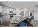 Bright, modern kitchen with stainless steel appliances, ample counter space, and a large island with bar seating at 2776 E Mews Rd, Gilbert, AZ 85298