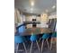 Spacious kitchen with ample counter seating, stainless steel appliances, and plenty of cabinet storage at 2776 E Mews Rd, Gilbert, AZ 85298