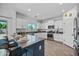 Modern kitchen featuring stainless appliances, white cabinets, and a breakfast bar at 2776 E Mews Rd, Gilbert, AZ 85298