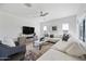 Comfortable living room featuring a ceiling fan and large sectional sofa at 2776 E Mews Rd, Gilbert, AZ 85298
