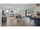 Open-concept living room with sliding glass doors to the backyard and modern finishes at 2776 E Mews Rd, Gilbert, AZ 85298