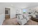 Bright living space boasting comfortable seating, modern decor, and a tranquil ambiance perfect for relaxation and entertainment at 2776 E Mews Rd, Gilbert, AZ 85298