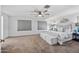 Serene bedroom with a ceiling fan, lots of natural light, and neutral tones for a peaceful retreat at 2776 E Mews Rd, Gilbert, AZ 85298