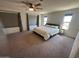 Spacious main bedroom featuring large windows, a ceiling fan, and neutral decor at 2776 E Mews Rd, Gilbert, AZ 85298