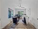 Inviting home office with two blue chairs, ceiling fan, plush rug, and plenty of light from the window at 2776 E Mews Rd, Gilbert, AZ 85298