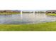 Scenic neighborhood pond with fountain features and manicured lawns at 2776 E Mews Rd, Gilbert, AZ 85298