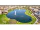 Large scenic pond with fountain features and views of the surrounding homes in the neighborhood at 2776 E Mews Rd, Gilbert, AZ 85298