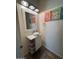 Modern powder room featuring a white vanity and stylish decor at 2776 E Mews Rd, Gilbert, AZ 85298