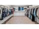 Spacious walk-in closet with ample storage and well-organized shelving and hanging space for clothes and accessories at 2776 E Mews Rd, Gilbert, AZ 85298