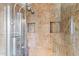 Modern bathroom shower with dual heads, tiled walls and recessed shelving at 2850 E Cortez St, Phoenix, AZ 85028